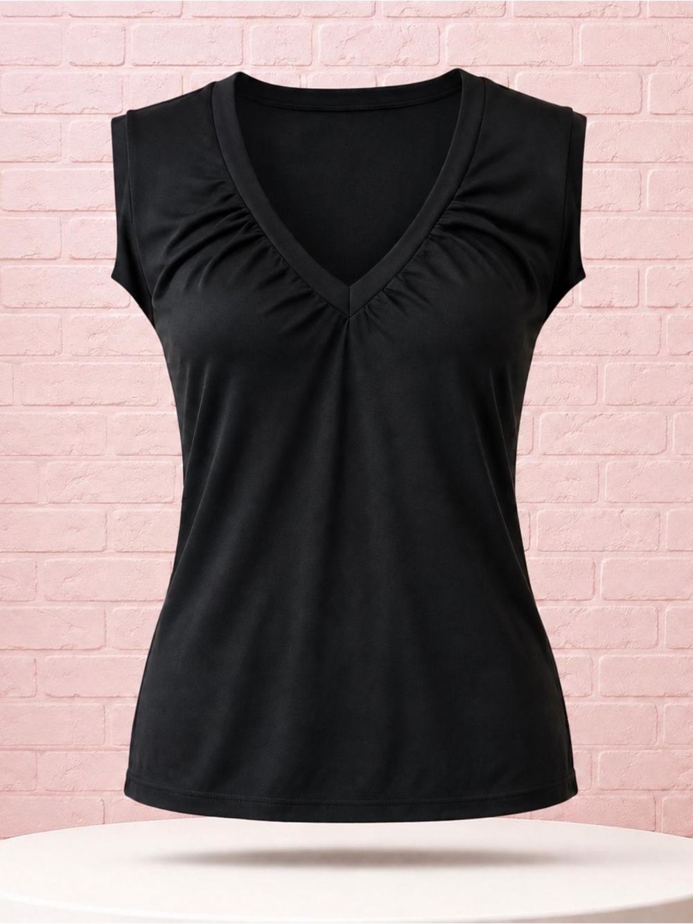 New York & Company black V-neck top in women’s size Medium.